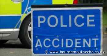 Road closed after crash near shopping centre