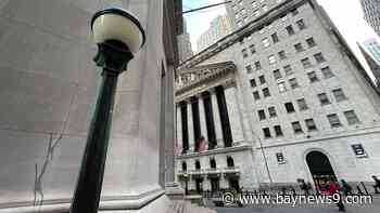 Wall Street ticks to another record as stocks worldwide rally