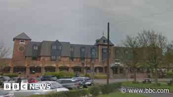 Man arrested after woman found dead in hotel room