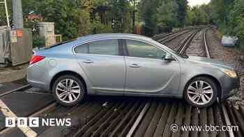 Train disruption after car blocks level crossing