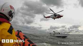 Rescue helicopter airlifts casualty from yacht