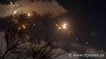 Iran fires dozens of missiles into Israel in a sharp escalation of regional conflict