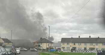 Firefighters tackle blaze at derelict building in Moreton