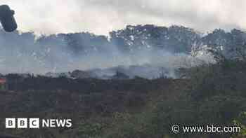 Teams of up to 40 firefighters fight compost blaze