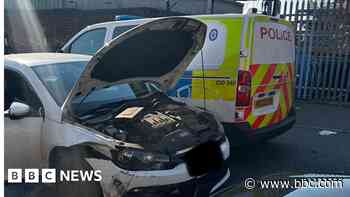 Arrest after police cars rammed and officers hurt