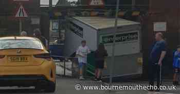 Lorry stuck under low railway bridge