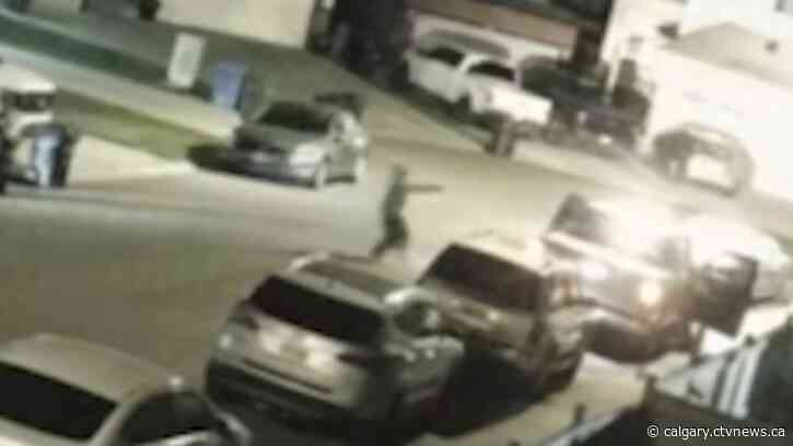 Security video shows suspect firing into vehicle in Calgary