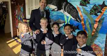 The primary school rewarding pupils with watches for mastering time-telling