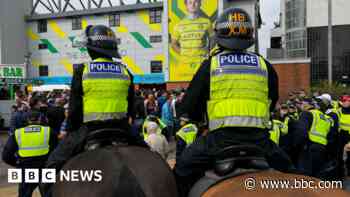 Police charge 20 after football derby violence