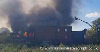 WATCH: Haslingden warehouse goes up in flames as emergency services remain at site