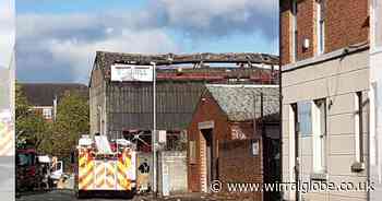 Firefighters remain at scene of warehouse blaze in Birkenhead