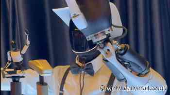 Tesla's new robot Optimus dons ridiculous outfit at event hosted by Elon Musk