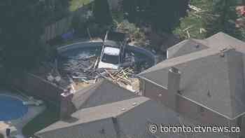 Pedestrian critical after truck crashes through fence in Whitby, lands in swimming pool