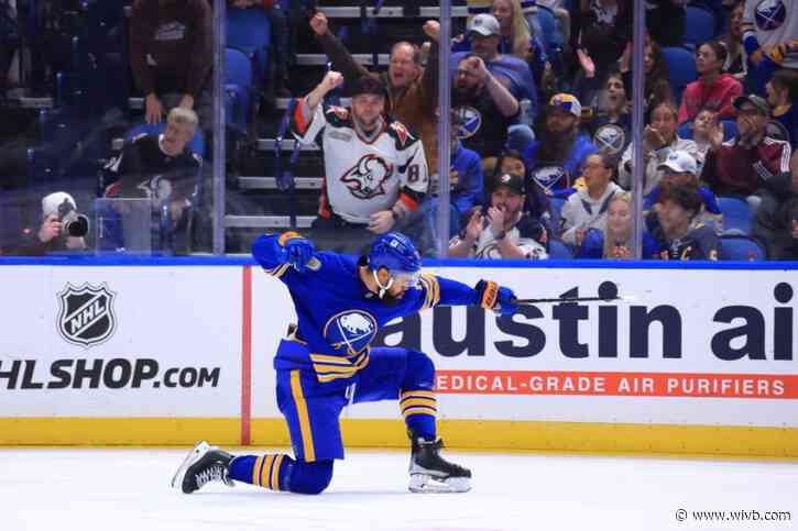 Sabres find scoring touch in beating Cup champs for 1st win