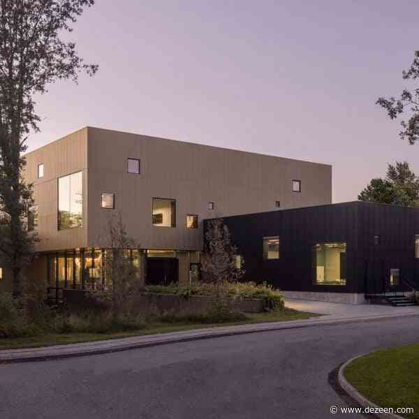 Rørbæk og Møller Arkitekter clads Danish university extension in gold-toned metal