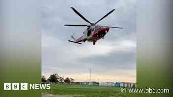 Two people rescued after boat capsizes at sea