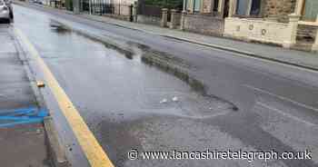 WATCH: Water gushing onto main road causing cars to swerve round