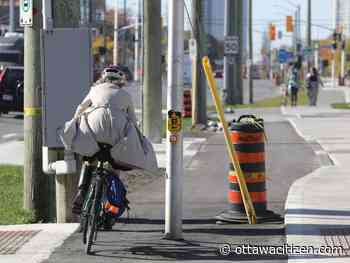 This new Ottawa bike lane comes with a pole in the middle, but why is it there?