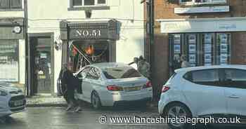 Car smashes through shop front causing traffic delays in Whalley