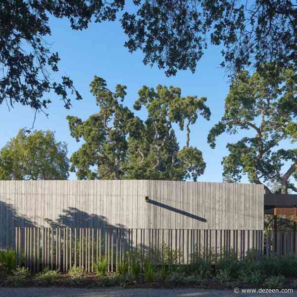 Tall "acoustic wall" buffers noise at Modal Home in Silicon Valley