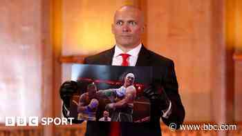 Usyk asks Fury to sign photo of him being punched in face