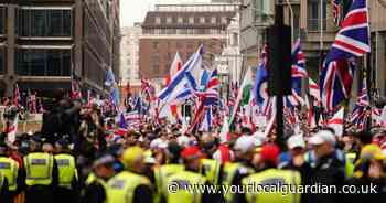 Thousands gather for Tommy Robinson’s protest in London as he remains in custody