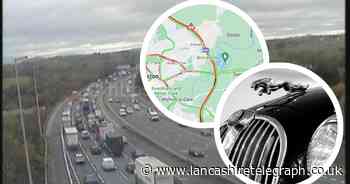 Delays on motorway after Jaguar driver crashes into central reservation