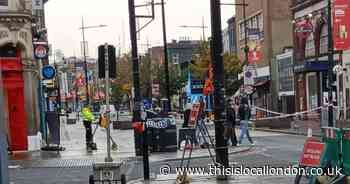 Part of high street and station closed after man in his 20s stabbed