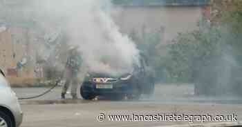 Dramatic photos and videos show car in flames near Blackburn town centre