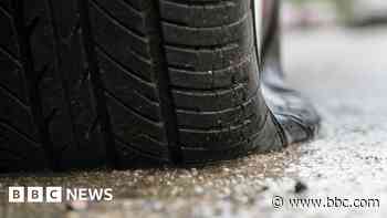 Car tyres deflated by climate activists
