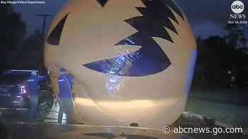 WATCH:  Cop 'attacked' by giant inflatable runaway pumpkin
