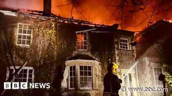 Arson arrest after large house fire in village