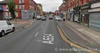 Man arrested after car crashes into shops on Wirral street