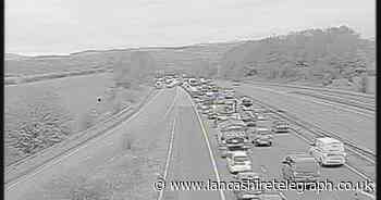 Long delays on M66 after van fire