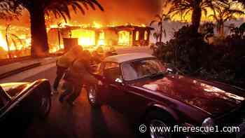 Over 10,000 evacuate as wind-driven wildfire destroys Calif. homes