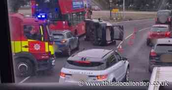 Car tipped to side in A406 crash - recap