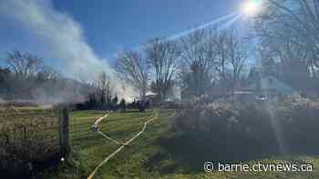 Fire burns trailer in wooded area