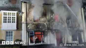 Road closed as fire service tackles fire