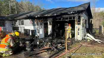 Firefighter, officer injured rescuing dogs from fire, one person hospitalized