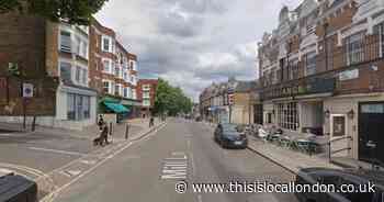 Road shut and forensics tent near pub after man dies