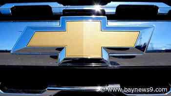 General Motors lays off about 1,000 workers, cutting costs to compete in a crowded automobile market