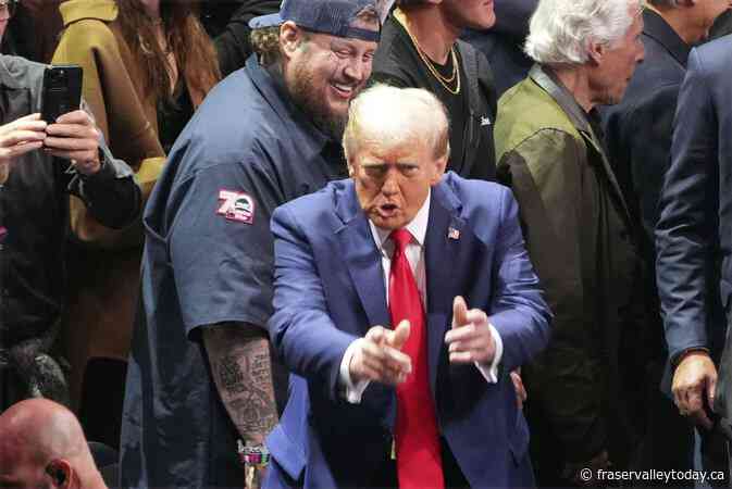 Trump takes a break from making Cabinet picks and attends UFC championship fight in New York