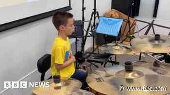 Boy performs 12-hour drumathon for charity