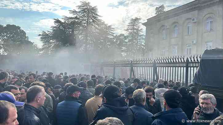 Protesters storm Putin-backed parliament in Georgia breakaway region