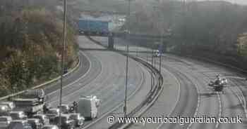 Motorcyclist fighting for life after crash with car on M25