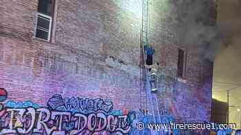 Iowa firefighters improvise with ladders to rescue trapped occupant