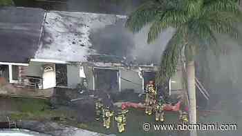 Firefighters battle house fire in Davie