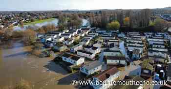 People and pets rescued by boat from flooding at caravan park