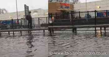 Shocking video shows man surrounded by water as road near Brent Cross submerged