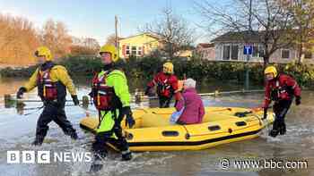 Fire crews rescue 12 people from flooded park homes